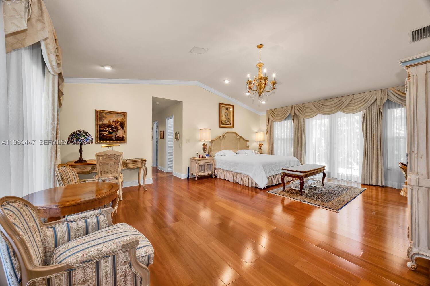 8840 Southwest 102nd Terrace Miami, FL 33176 - Photo 11 of 23 a living room with furniture and a chandelier