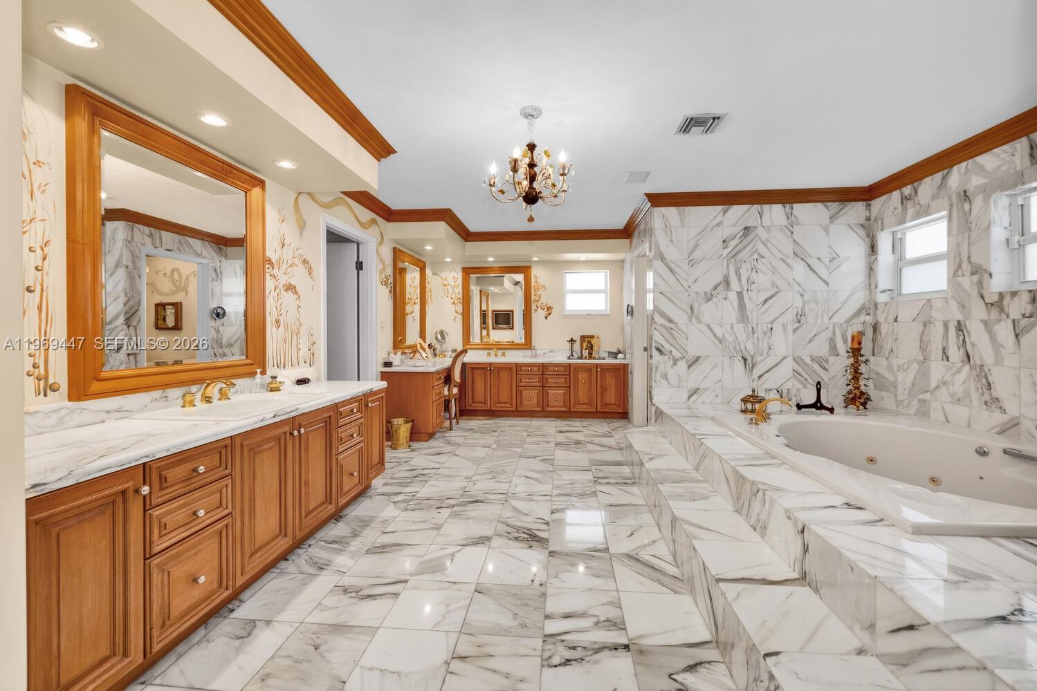 8840 Southwest 102nd Terrace Miami, FL 33176 - Photo 12 of 23 a large spacious bathroom with a double vanity sink a large mirror and a bathtub