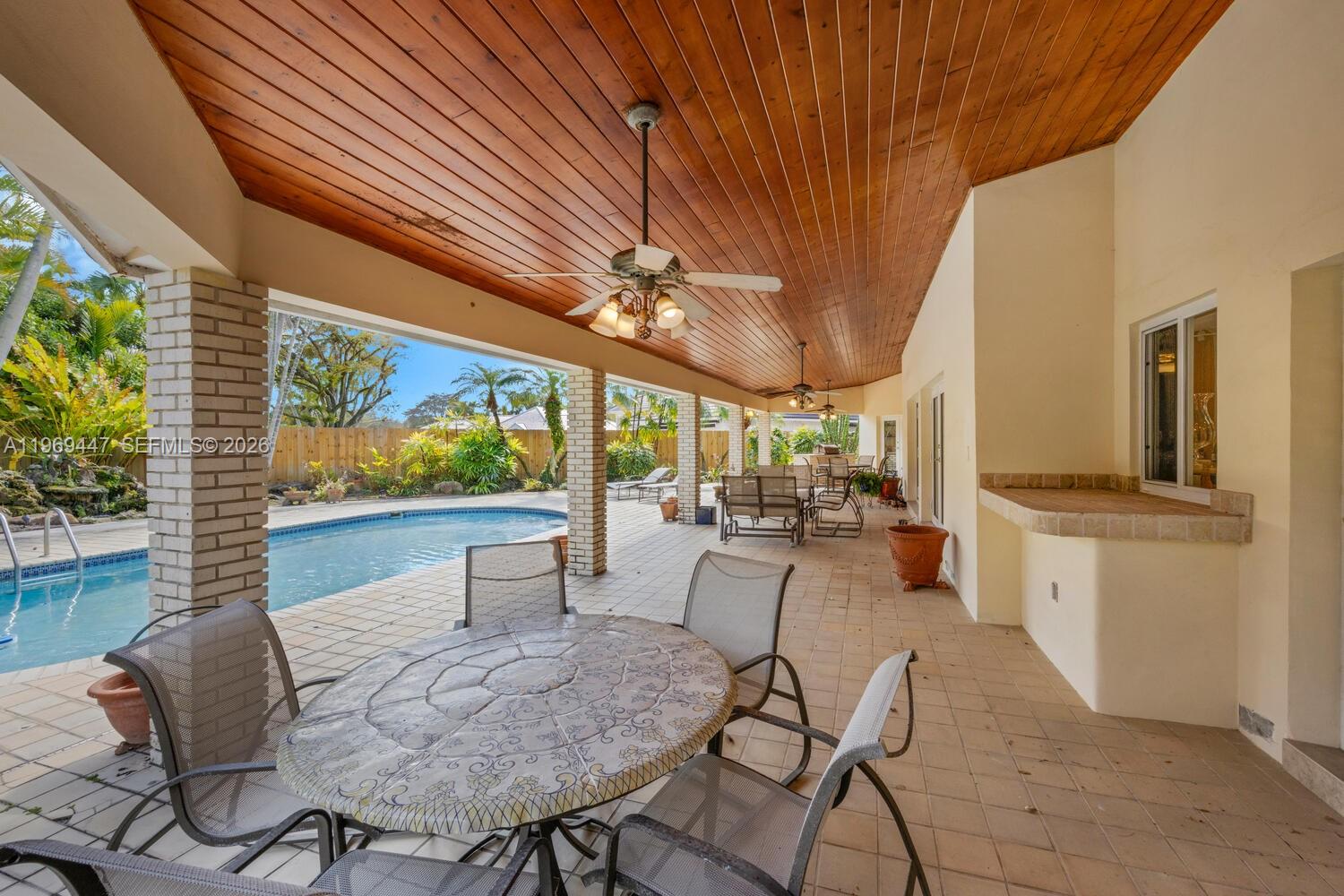 8840 Southwest 102nd Terrace Miami, FL 33176 - Photo 16 of 23 a view of a dining room with furniture window and outside view
