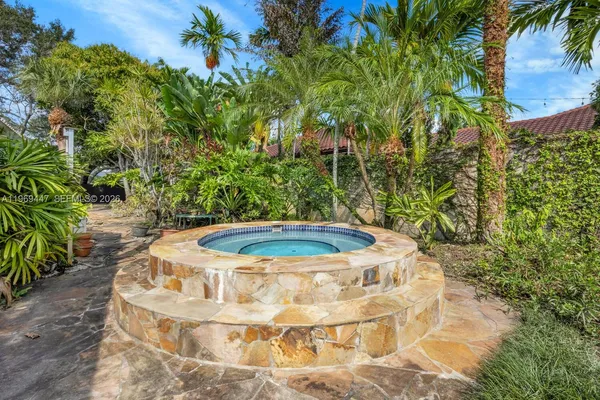 a view of a swimming pool with a yard