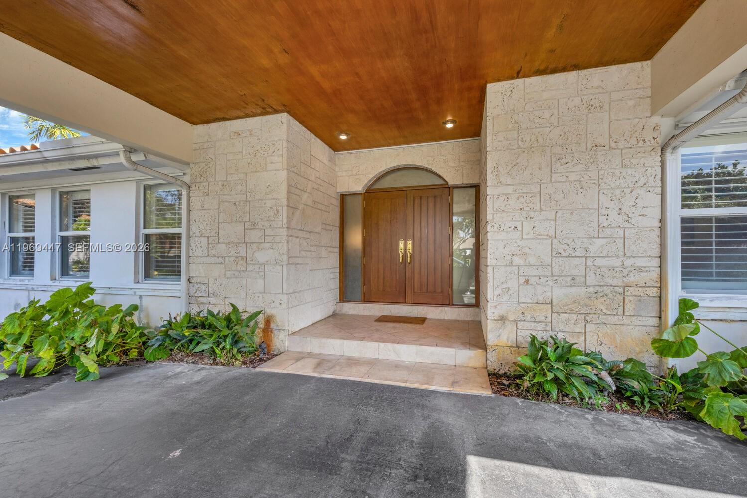 8840 Southwest 102nd Terrace Miami, FL 33176 - Photo 3 of 23 a front view of a house with a yard