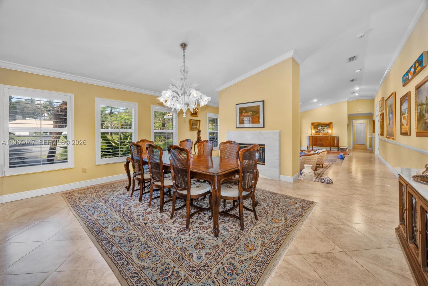 8840 Southwest 102nd Terrace Miami, FL 33176 - Photo 5 of 23 a view of a dining room with furniture a chandelier and wooden floor