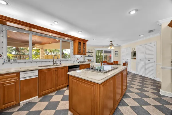 a kitchen with a sink stove and cabinets