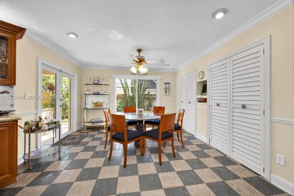 a dining room with a table and chairs