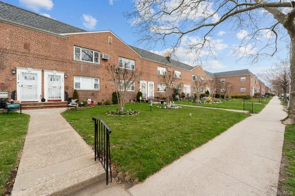 a view of a building with a yard
