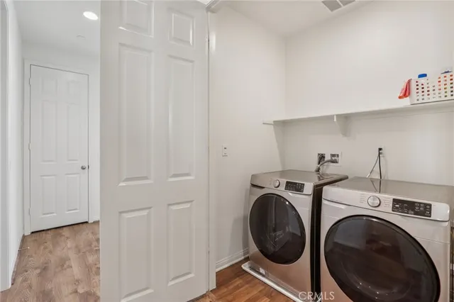 a view of storage and utility room with washer and dryer