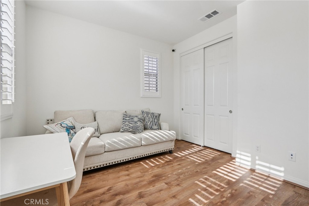 7656 Channel View Street Chino, CA 91708 - Photo 12 of 40 a bedroom with a bed and a window