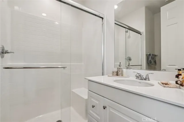 a bathroom with a sink double vanity and a mirror