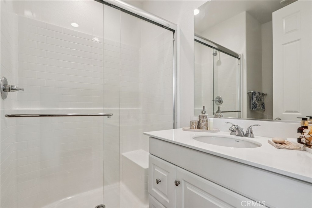 7656 Channel View Street Chino, CA 91708 - Photo 14 of 40 a bathroom with a sink double vanity and a mirror