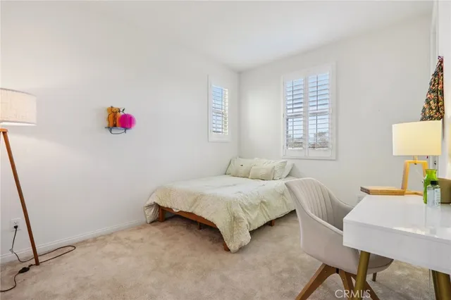 a bedroom with a bed and a table