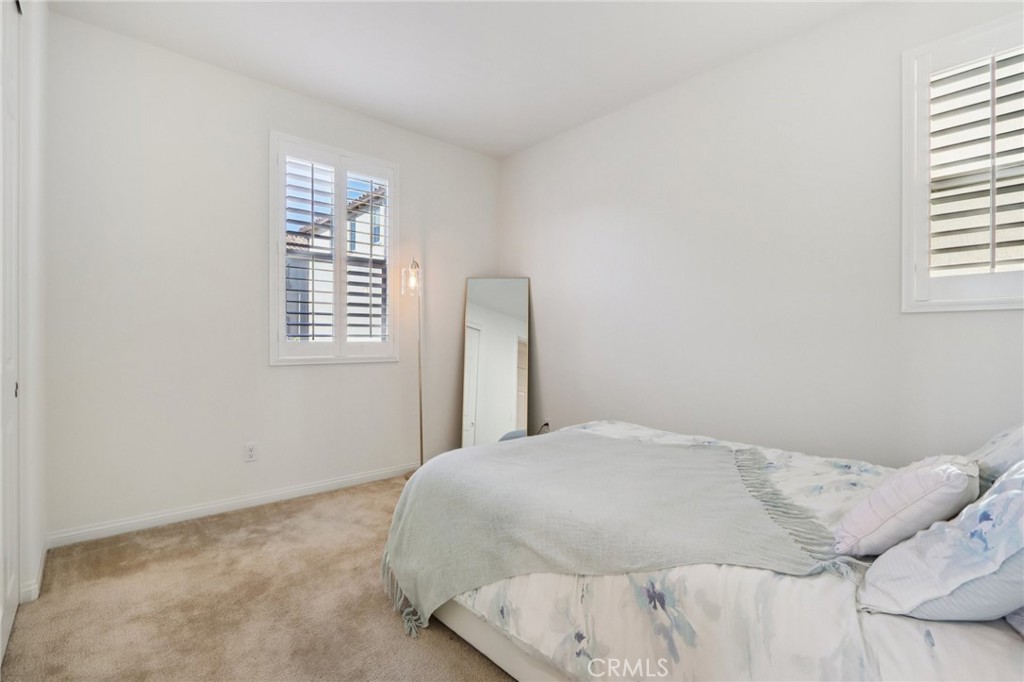 7656 Channel View Street Chino, CA 91708 - Photo 19 of 40 a bedroom with a bed and a window