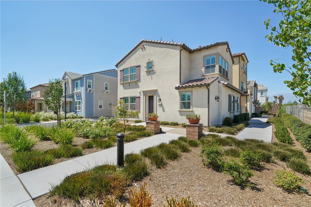 7656 Channel View Street Chino, CA 91708 - Photo 2 of 40 a front view of a house with garden