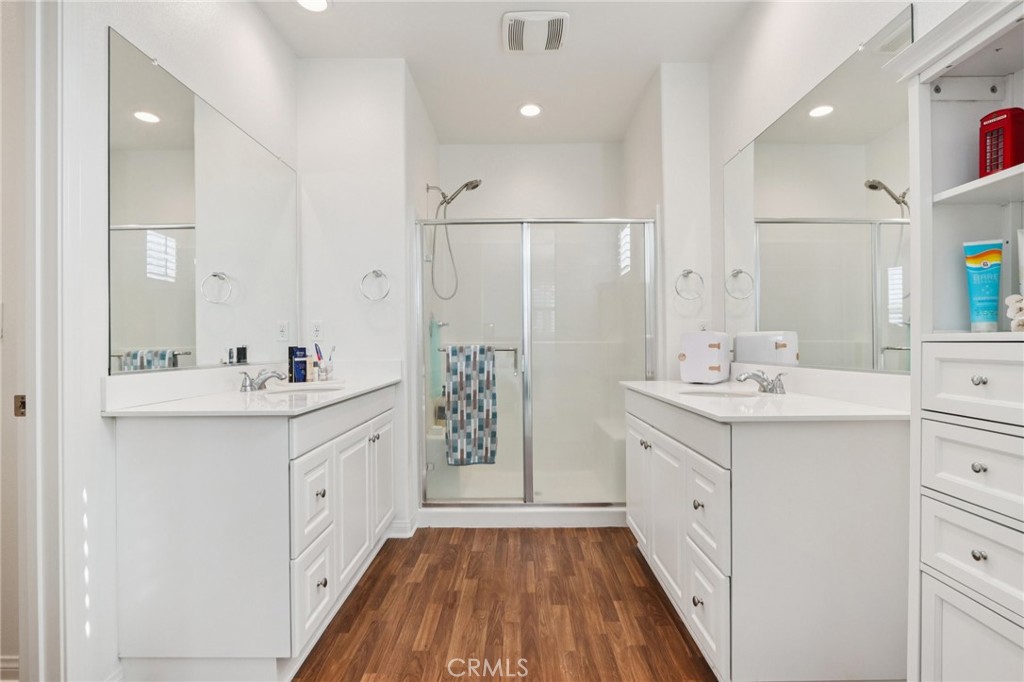 7656 Channel View Street Chino, CA 91708 - Photo 23 of 40 a bathroom with a double vanity sink mirror and shower