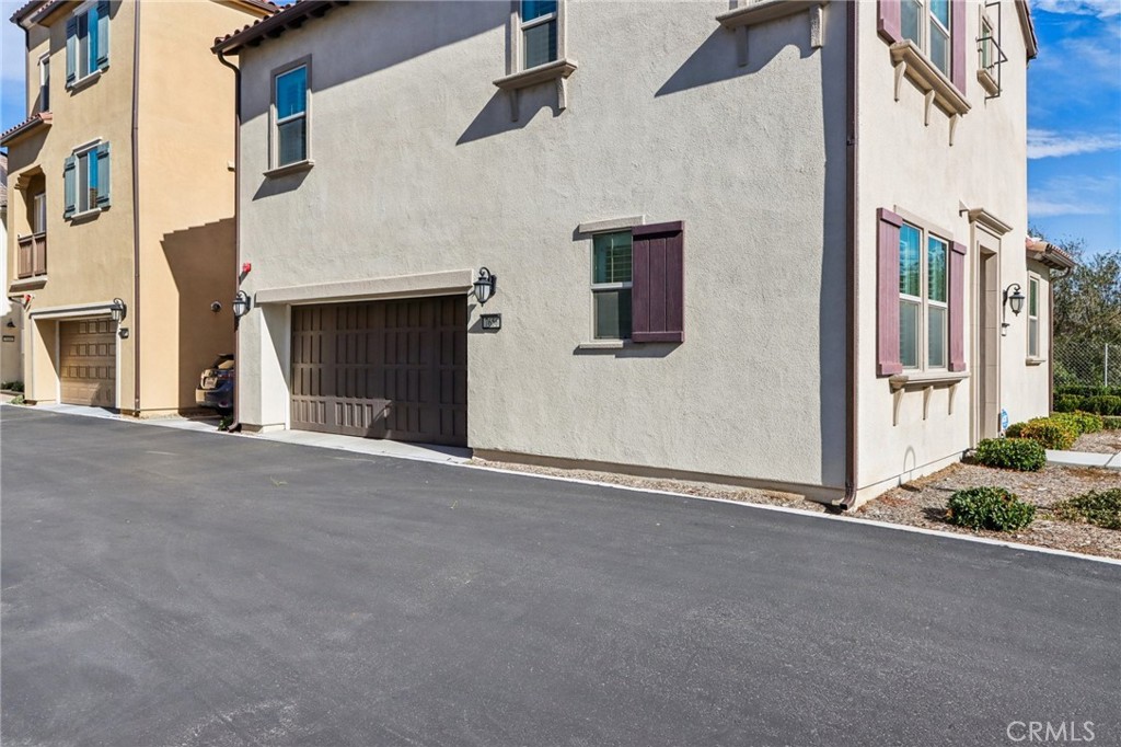 7656 Channel View Street Chino, CA 91708 - Photo 25 of 40 front view of a house with a street