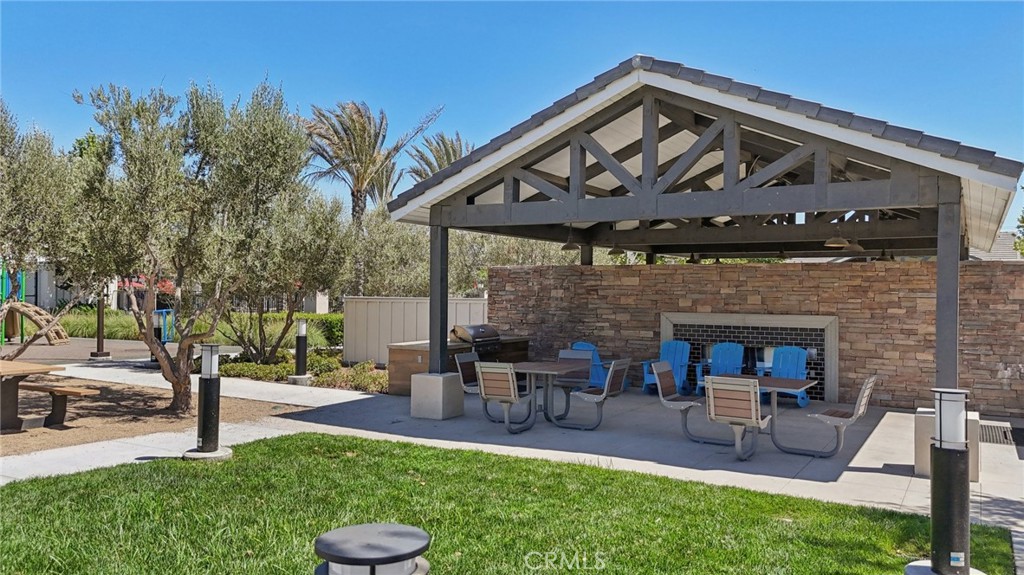 7656 Channel View Street Chino, CA 91708 - Photo 27 of 40 a view of a chairs and table in backyard of the house
