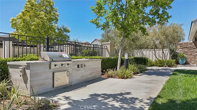 a view of a backyard with sitting area