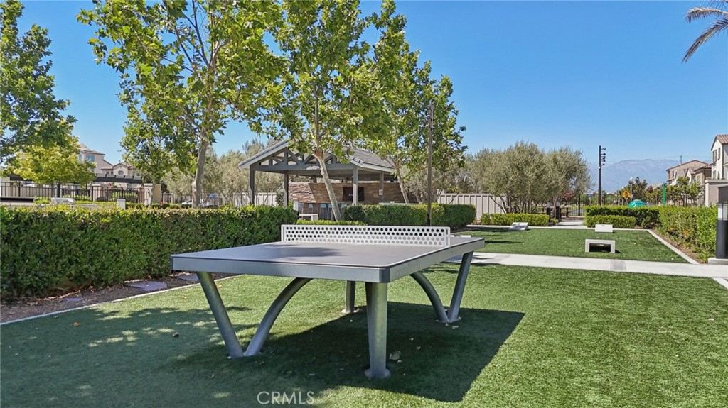 7656 Channel View Street Chino, CA 91708 - Photo 30 of 40 a view of a house with a yard porch and sitting area