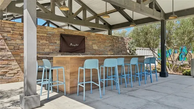 a view of a chairs and table in the patio