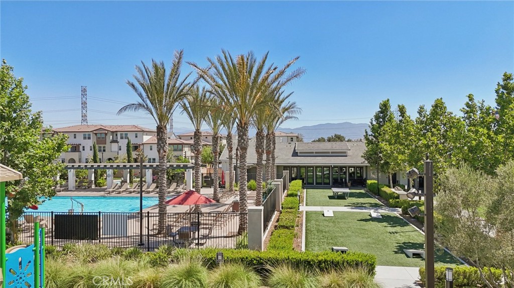 7656 Channel View Street Chino, CA 91708 - Photo 32 of 40 a view of a park with swings and slides