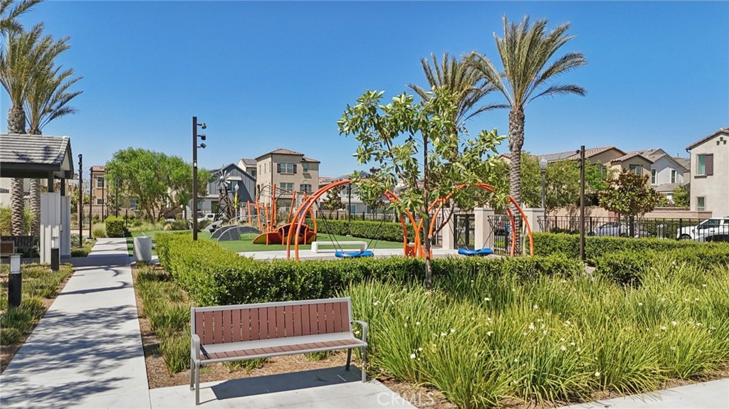 7656 Channel View Street Chino, CA 91708 - Photo 36 of 40 a view of a house with a yard and potted plants