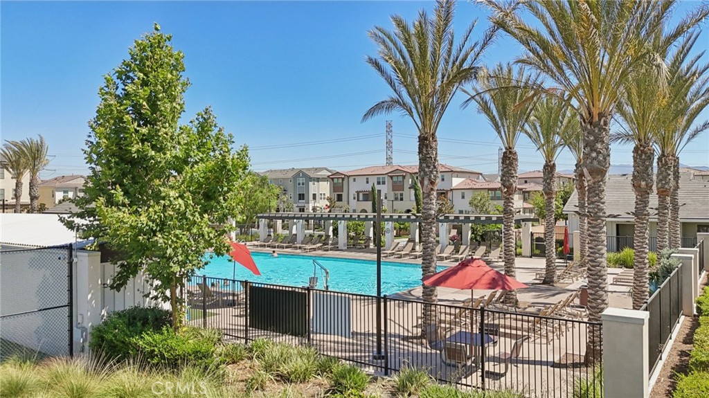 7656 Channel View Street Chino, CA 91708 - Photo 5 of 40 a view of swimming pool with a table and chairs