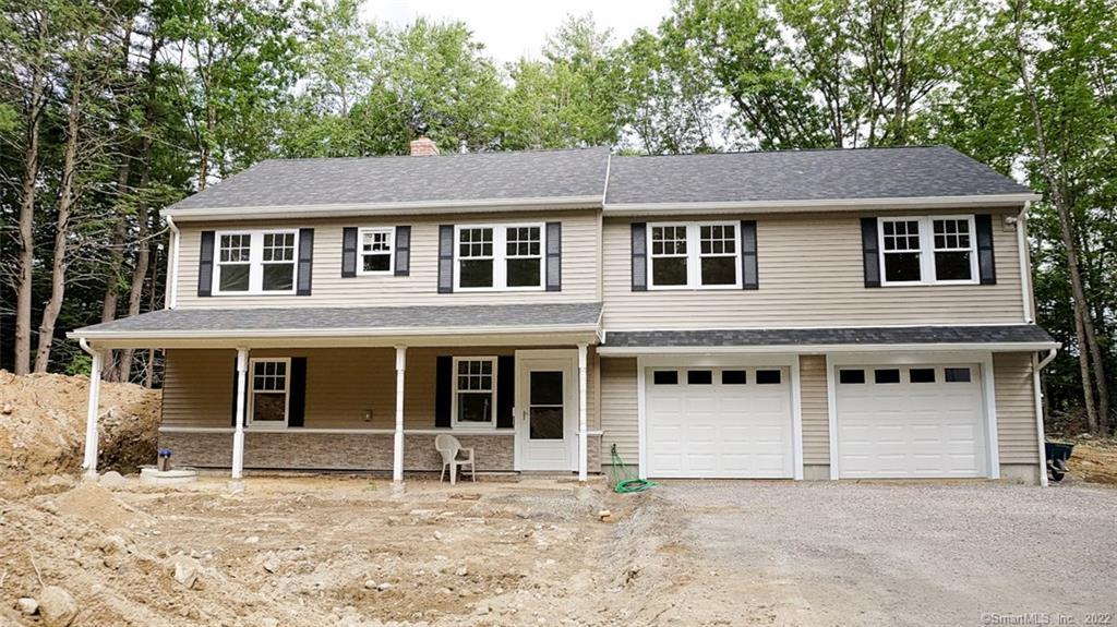 130 Gavitt Road Barkhamsted, CT 06063 - Photo 1 of 1 Front view shows covered front entrance and over-sized 4 car, tandem garage. Landscaping is being completed.