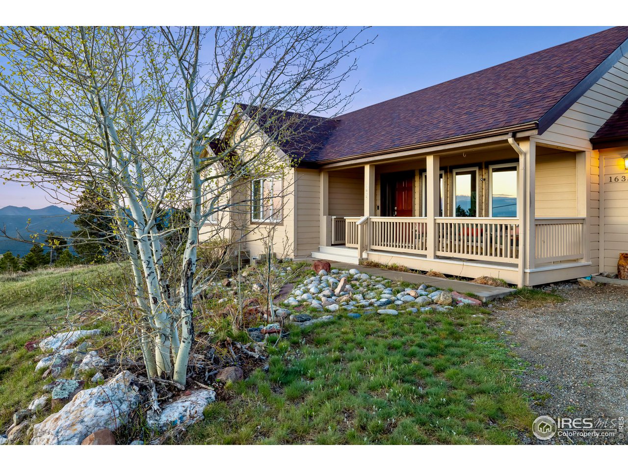 1635 Lost Angel Road Boulder, CO 80302 - Photo 1 of 37 Enjoy your morning coffee from the inviting front porch with views of Boulder and the back of the famous Flatirons