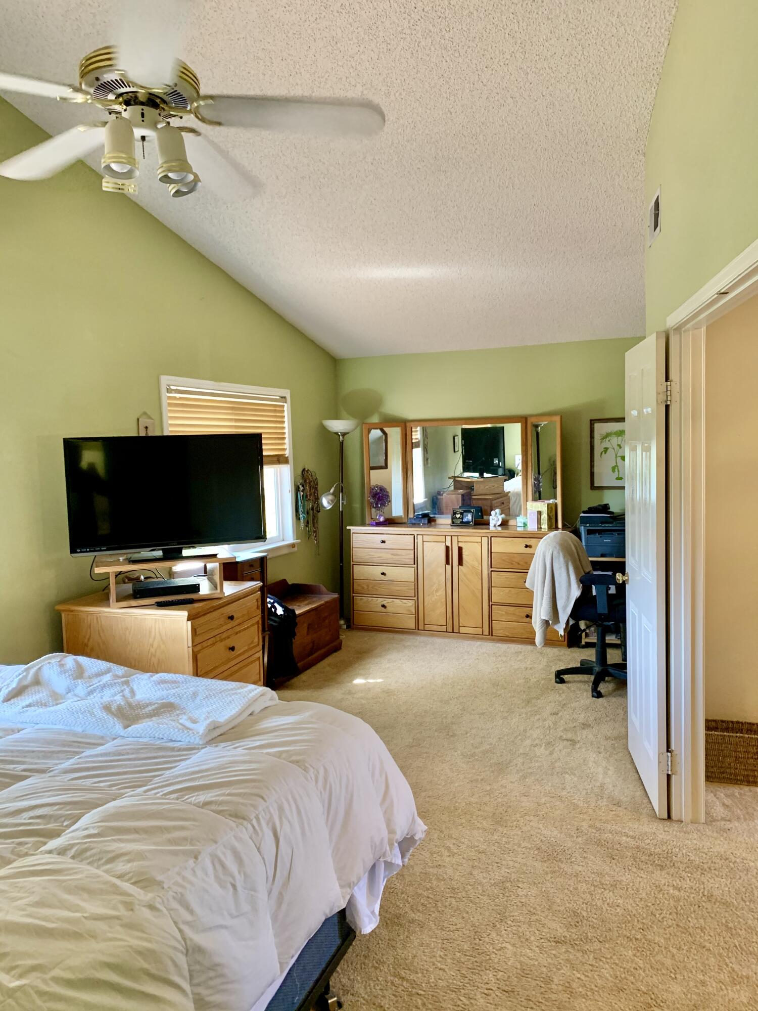 6589 Hawkley Drive Riverside, CA 92506 - Photo 14 of 29 a bedroom with furniture and a flat screen tv
