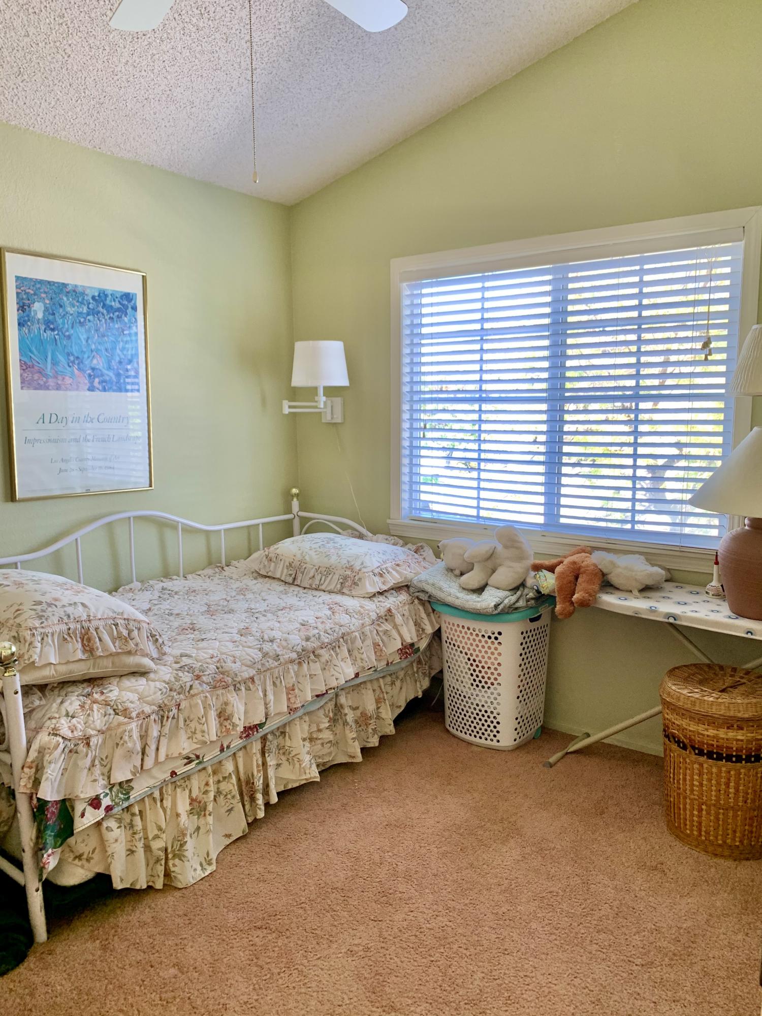 6589 Hawkley Drive Riverside, CA 92506 - Photo 3 of 29 a bedroom with a bed and a chandelier