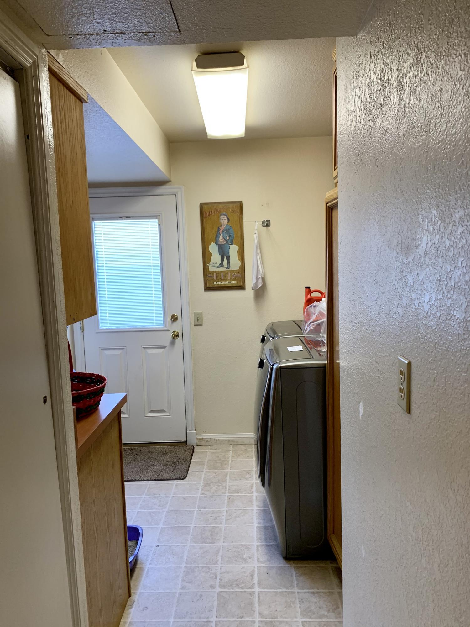 6589 Hawkley Drive Riverside, CA 92506 - Photo 22 of 29 a view of a hallway with entryway and bedroom