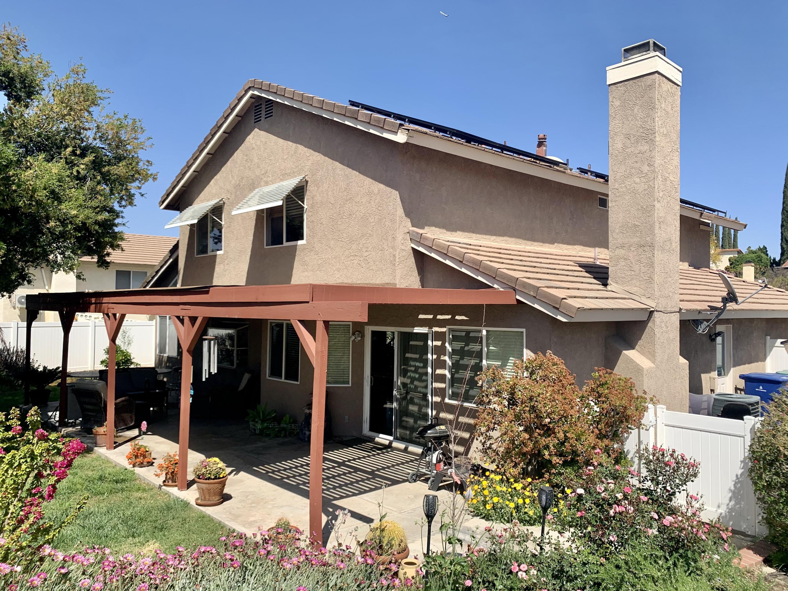 6589 Hawkley Drive Riverside, CA 92506 - Photo 23 of 29 a front view of a house with garden