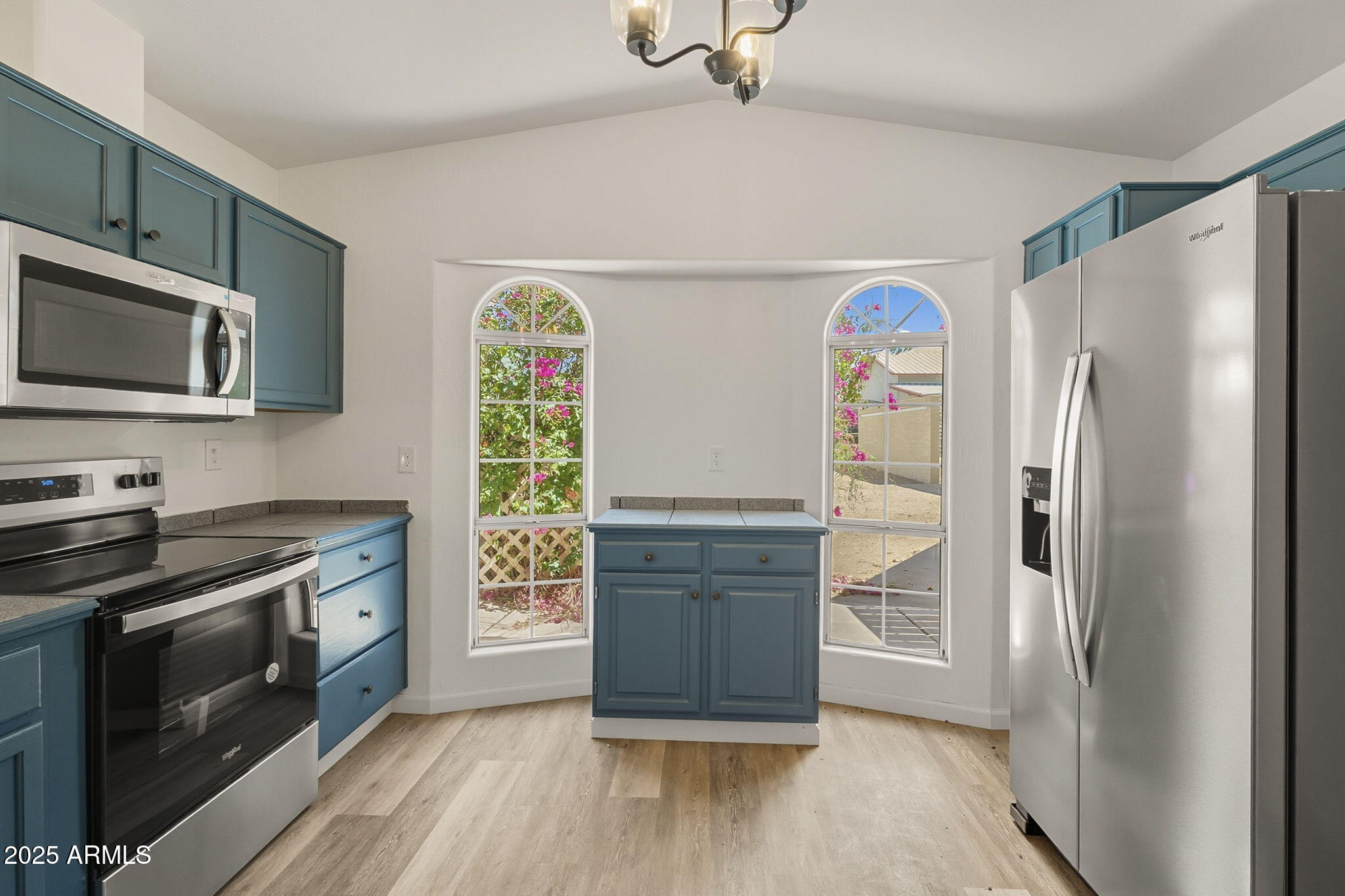 481 West Foothill Street Apache Junction, AZ 85120 - Photo 12 of 50 a kitchen with stainless steel appliances granite countertop a refrigerator stove and microwave