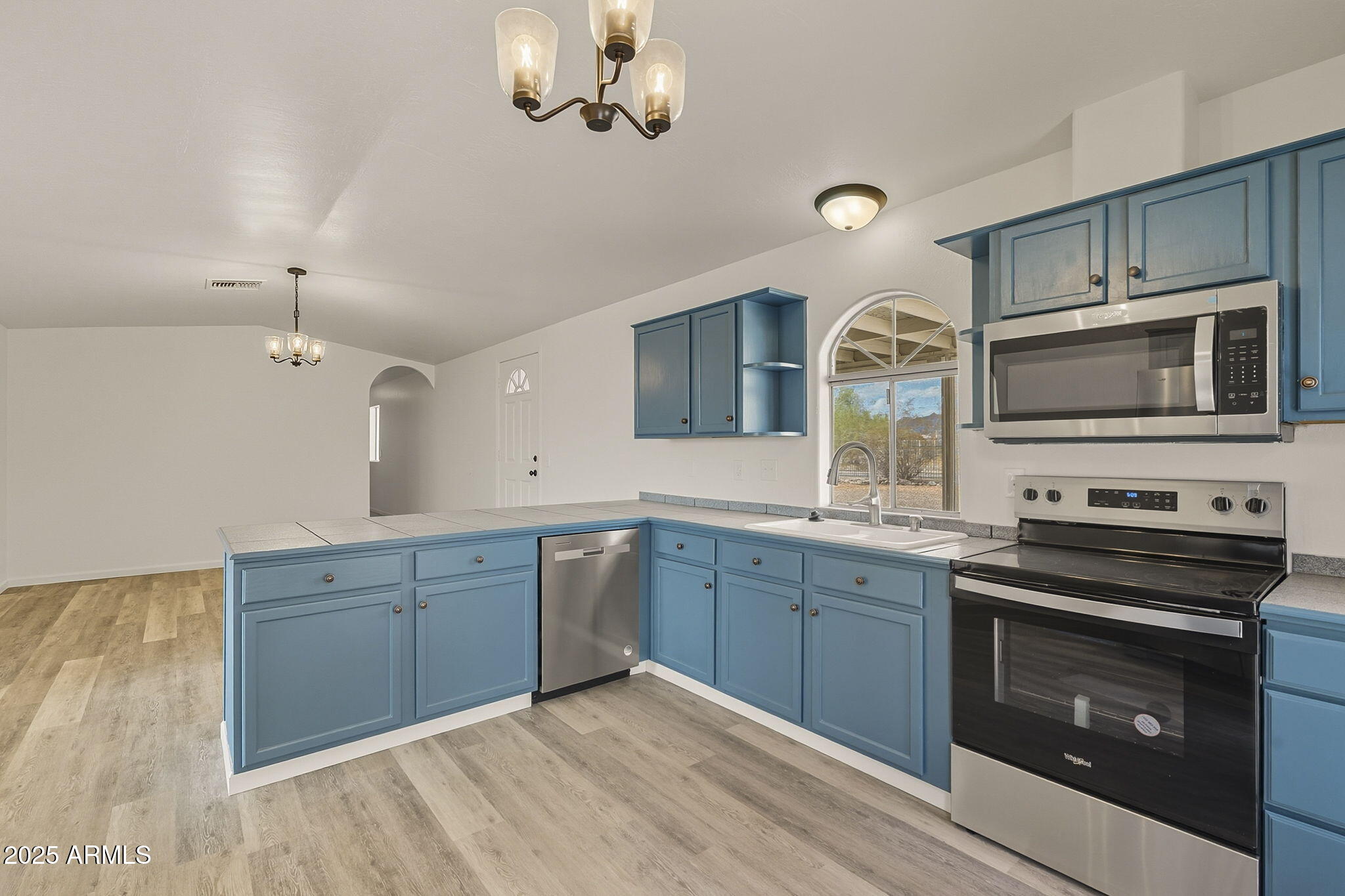 481 West Foothill Street Apache Junction, AZ 85120 - Photo 14 of 50 a kitchen with a sink stove and microwave