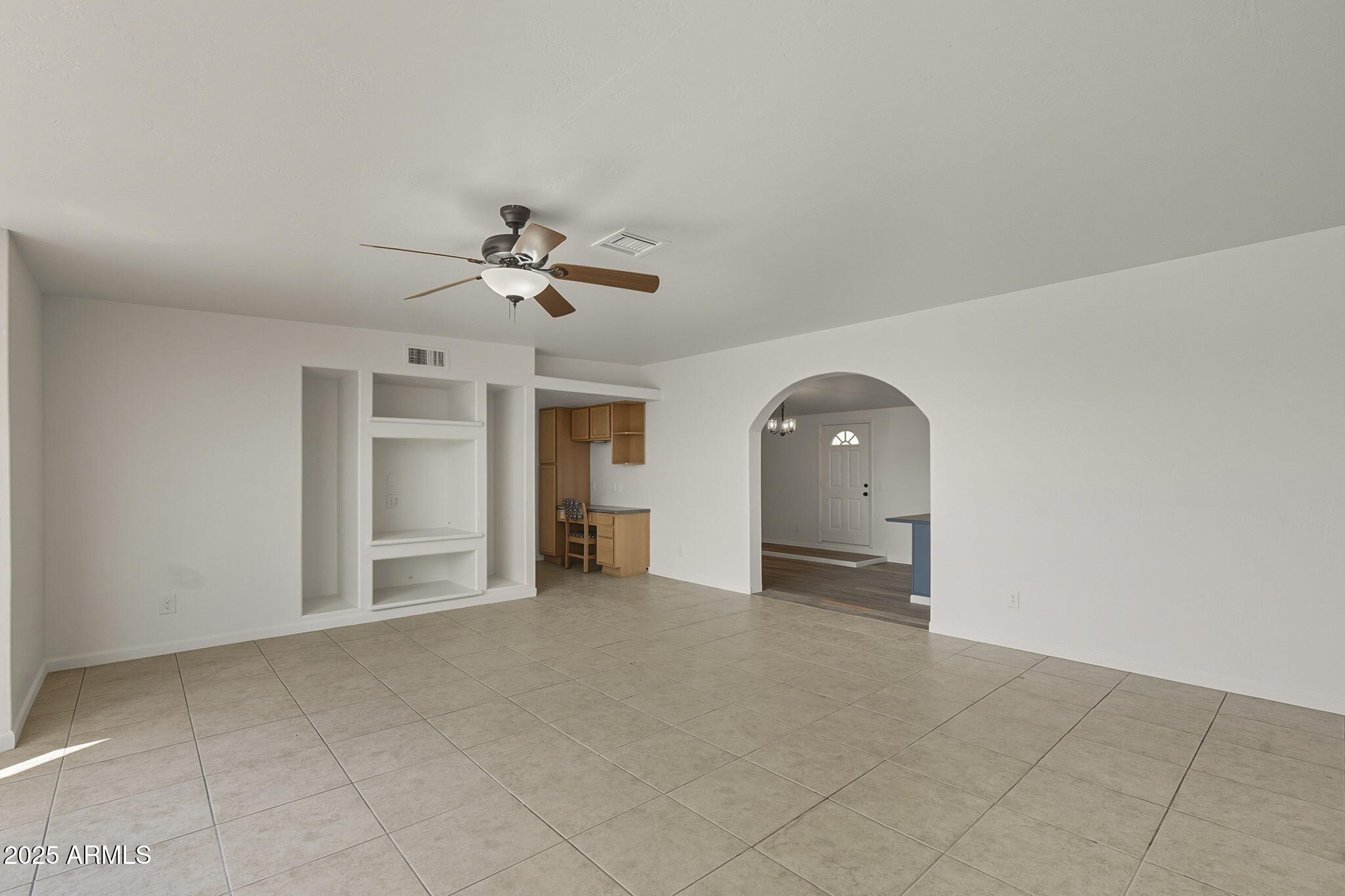 481 West Foothill Street Apache Junction, AZ 85120 - Photo 20 of 50 an empty room with a ceiling fan and a window