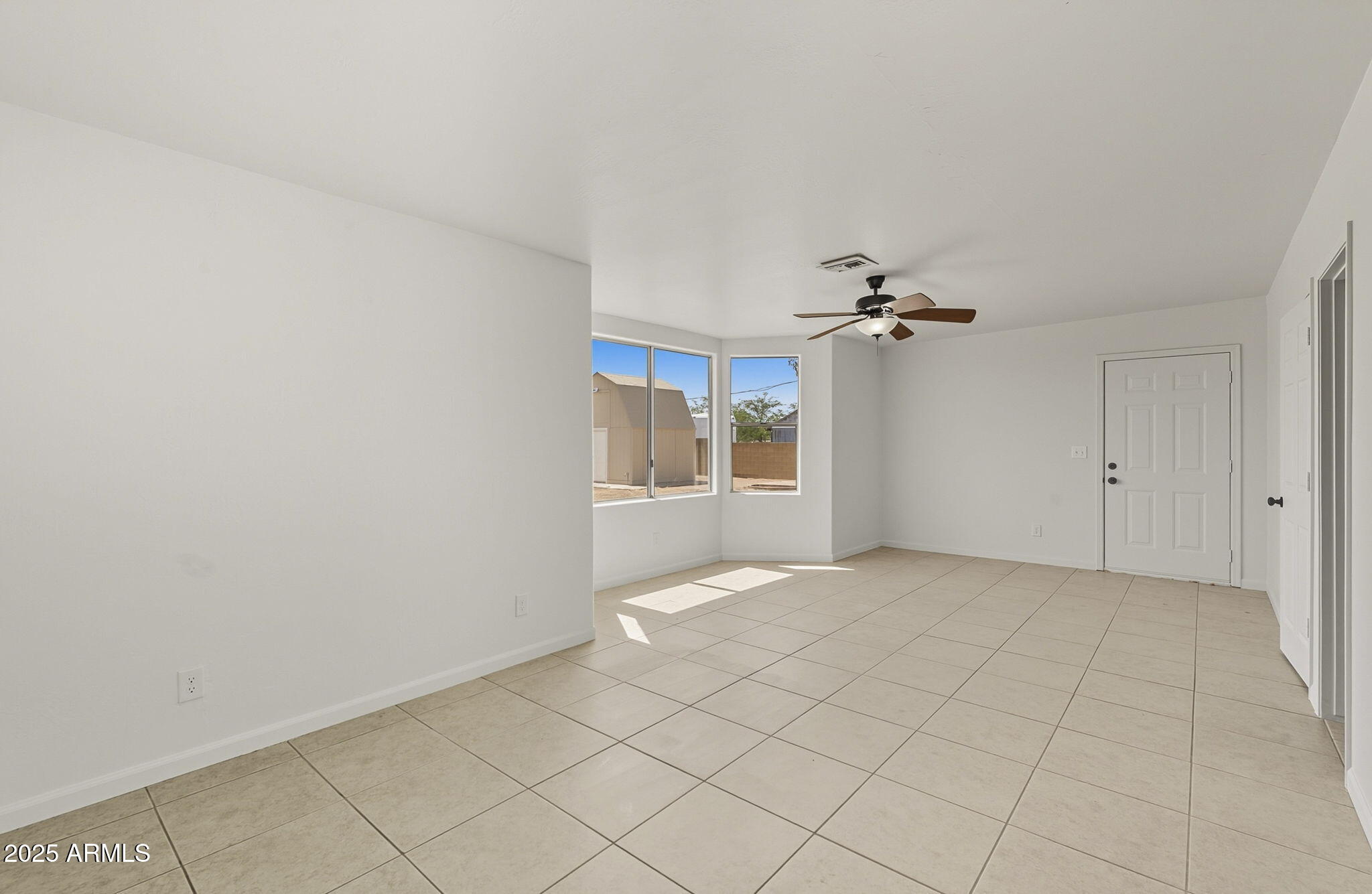 481 West Foothill Street Apache Junction, AZ 85120 - Photo 25 of 50 wooden floor in an empty room with a window