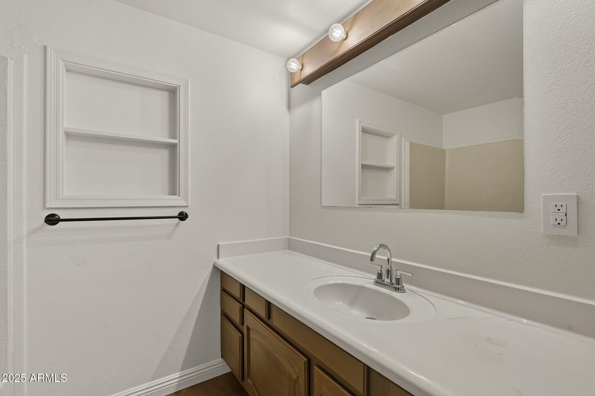 481 West Foothill Street Apache Junction, AZ 85120 - Photo 34 of 50 a bathroom with a sink and a mirror