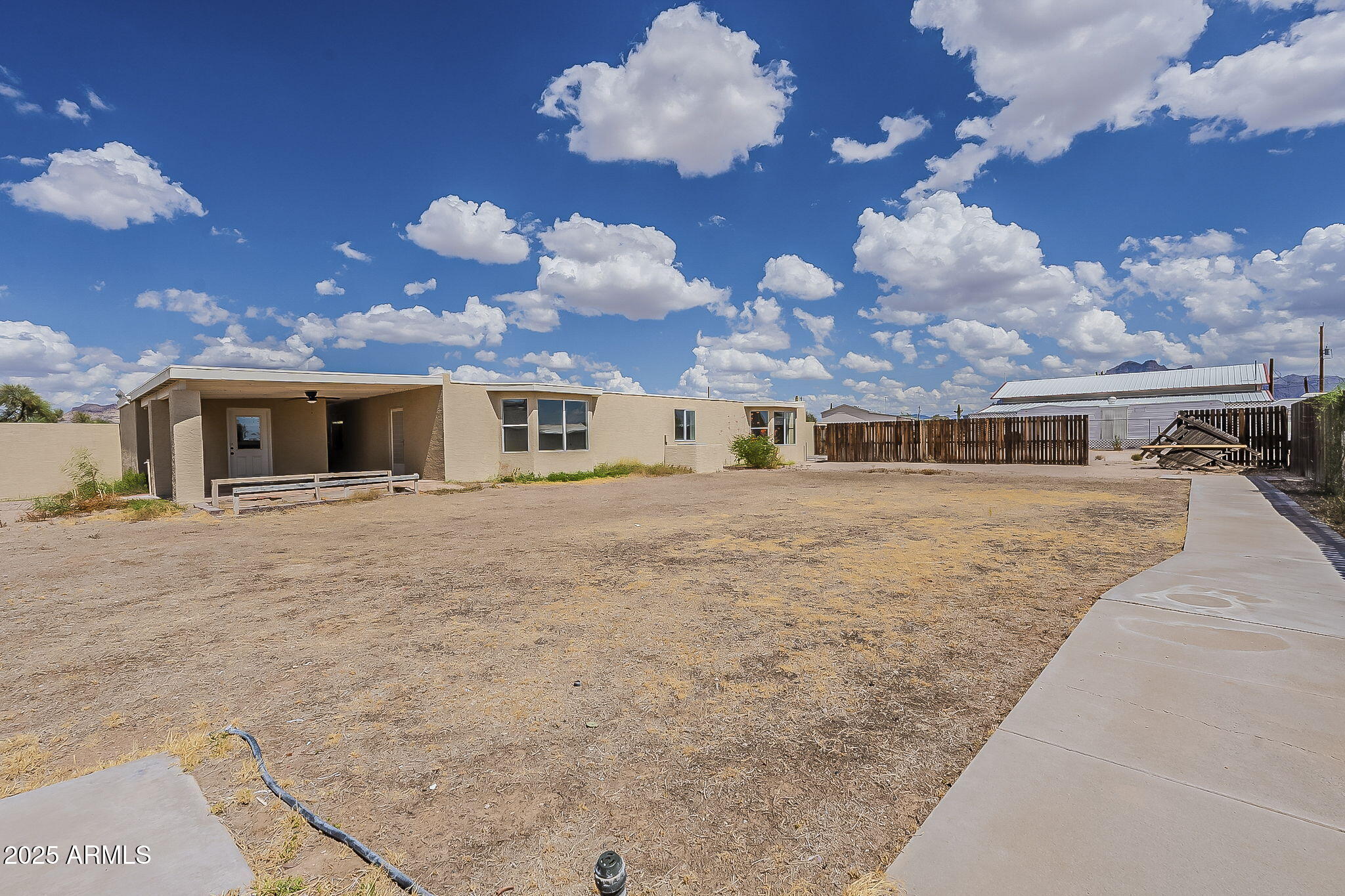 481 West Foothill Street Apache Junction, AZ 85120 - Photo 38 of 50 a front view of a house with a large tree