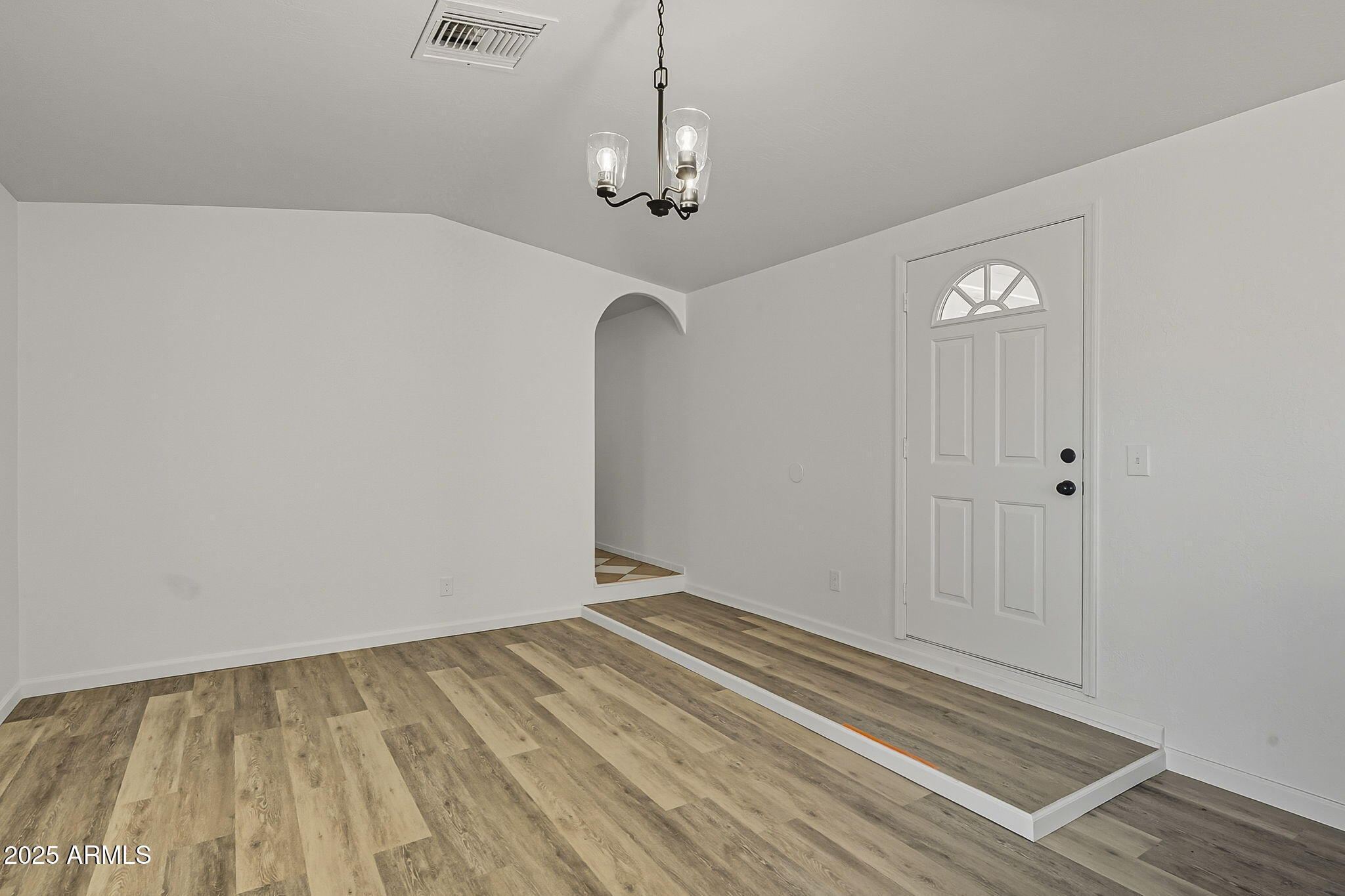 481 West Foothill Street Apache Junction, AZ 85120 - Photo 6 of 50 a view of a room with wooden floor and white walls