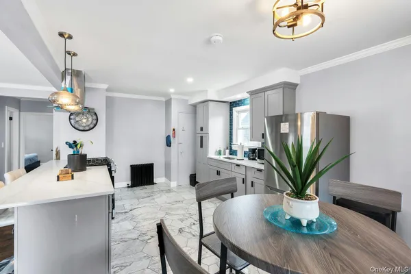 a living room with furniture potted plant and a window