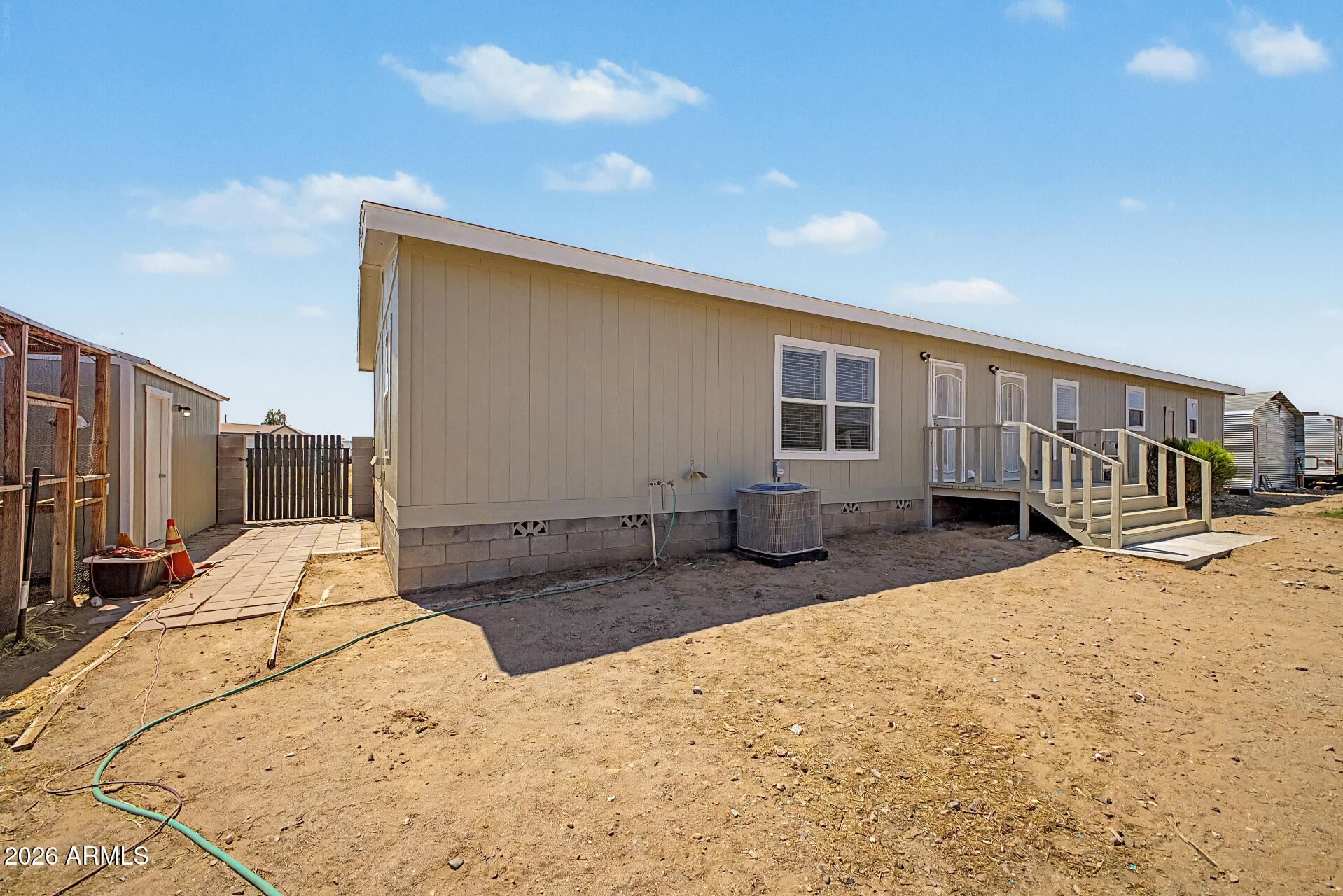 22417 West Dove Valley Road Wittmann, AZ 85361 - Photo 35 of 53 a house with trees in the background
