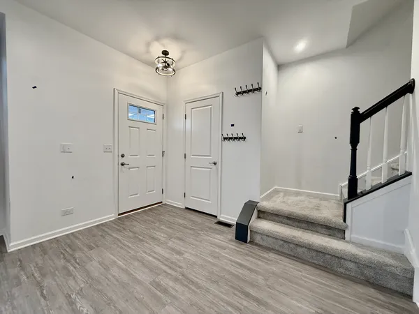 a view of a livingroom with hardwood floor and hallway