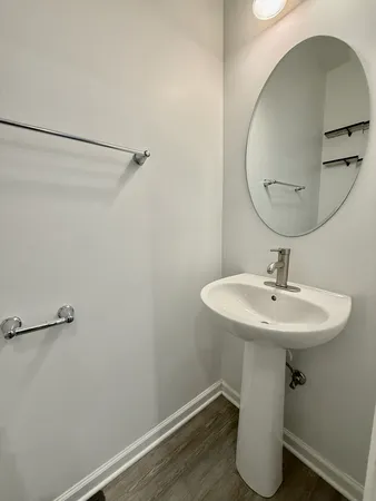 a bathroom with a sink and mirror