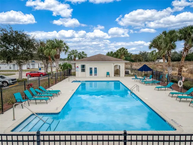 a view of a house with a swimming pool