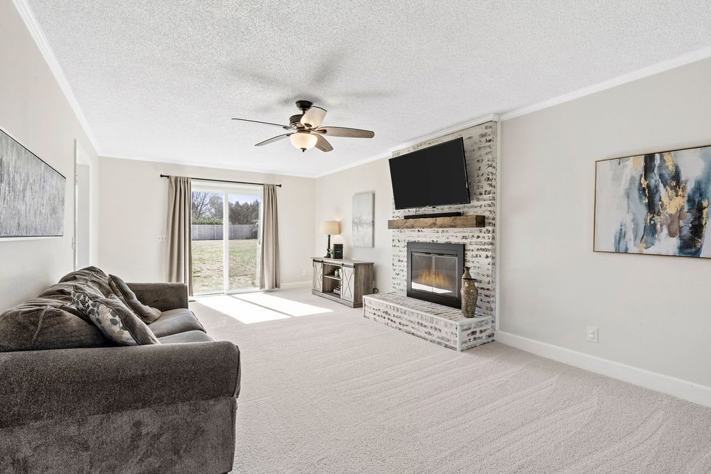1605 Habbot Drive Raleigh, NC 27603 - Photo 5 of 30 Family Room with Masonry Fireplace Creating the Perfect Nostalgic Feel