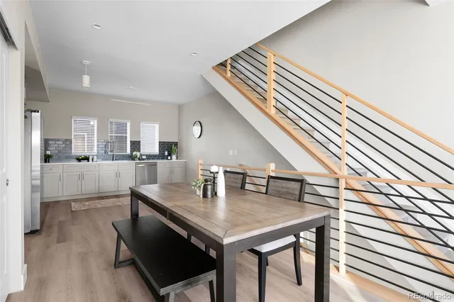 a view of kitchen and dining room with wooden floor