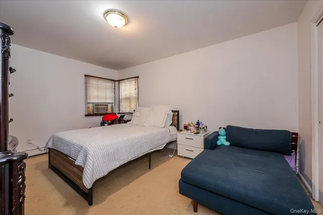 a bedroom with bed and a window