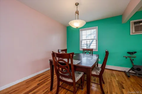 a view of a dining room with furniture and window