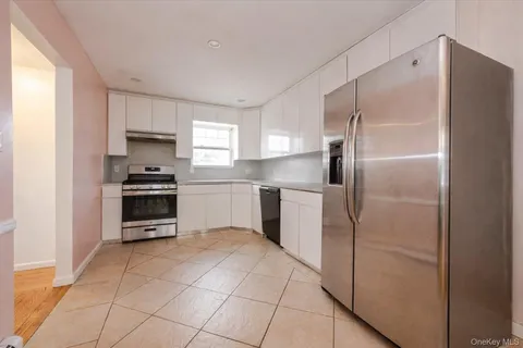 a kitchen with a refrigerator a sink and a stove