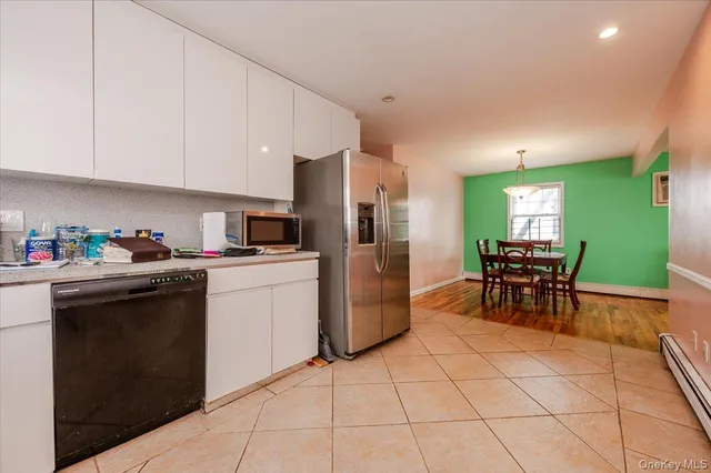 a kitchen with a sink cabinets and window