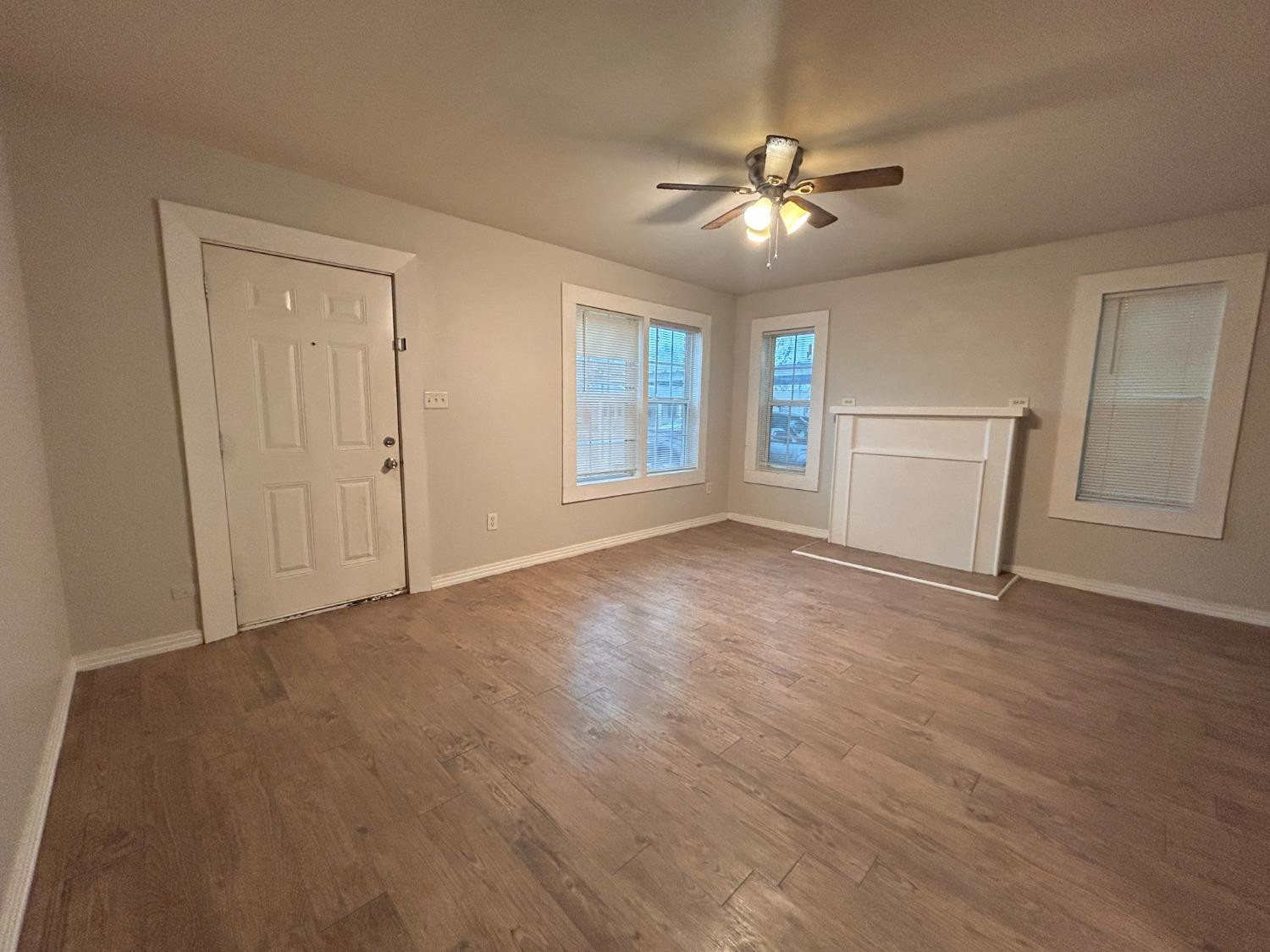 1925 26th Street Lubbock, TX 79411 - Photo 3 of 10 a view of an empty room with a window